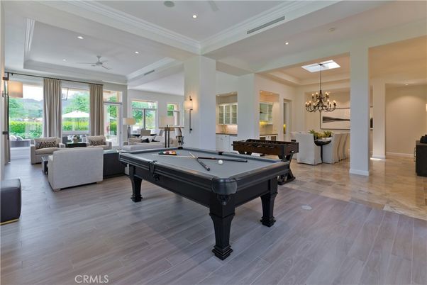Billiard Table, Chandelier, Game Room, Interior, Living room, Recessed Lighting, Wood Texture Flooring
