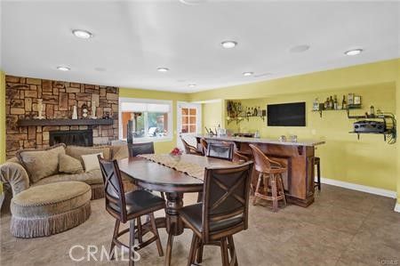 Dining room, Fireplace, Interior, Living room, Recessed Lighting, Stone Walls