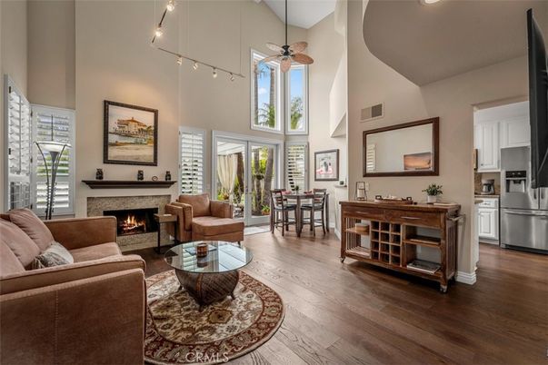 Dining room, Fireplace, Interior, Kitchen, Living room, Pendant Lights, Stainless Steel Appliances, Wood Texture Flooring