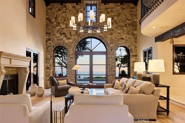 Chandelier, Fireplace, Interior, Living room, Recessed Lighting, Stone Walls, Water, Wooden Beams, Wood Texture Flooring