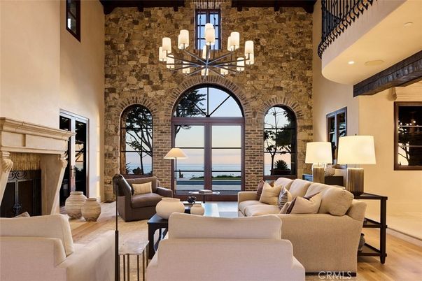Chandelier, Fireplace, Interior, Living room, Recessed Lighting, Stone Walls, Water, Wooden Beams, Wood Texture Flooring