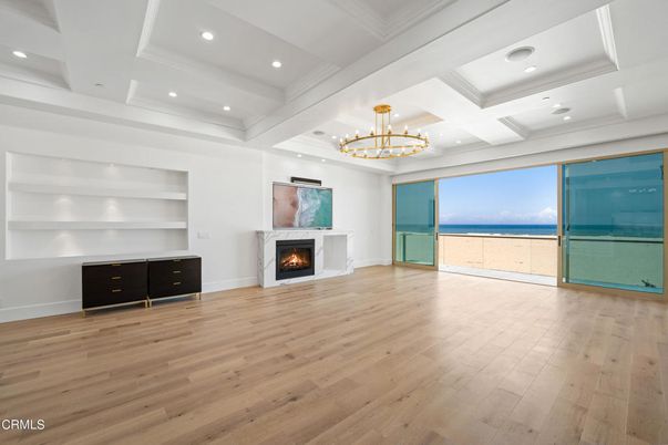 Chandelier, Empty room, Fireplace, Interior, Recessed Lighting, Water, Wood Texture Flooring