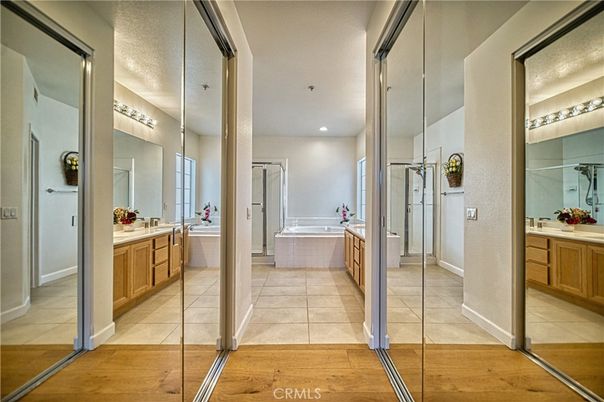Bathroom, Dual Sink Vanities, Glass Shower, Interior, Recessed Lighting, Wood Texture Flooring