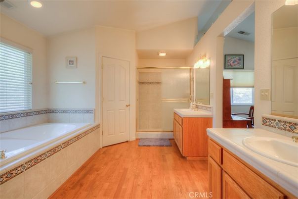 Bathroom, Dual Sink Vanities, Glass Shower, Interior, Recessed Lighting, Tile Countertops, Wood Texture Flooring