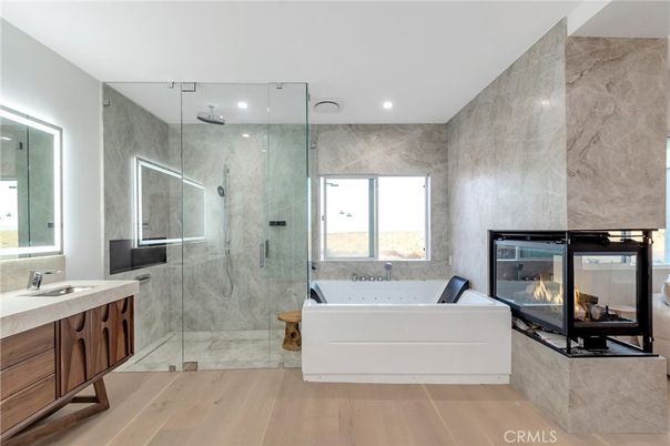Bathroom, Fireplace, Glass Shower, Interior, Marble Walls, Recessed Lighting, Wood Texture Flooring