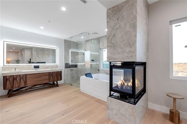 Bathroom, Fireplace, Glass Shower, Interior, Marble Walls, Recessed Lighting, Wood Texture Flooring