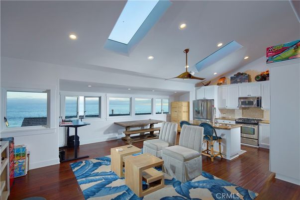 Dining room, Interior, Kitchen, Living room, Recessed Lighting, Stainless Steel Appliances, Water, Wood Texture Flooring