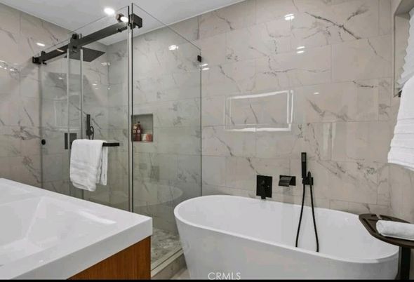 Bathroom, Free Standing Baths, Glass Shower, Interior, Marble Walls, Recessed Lighting