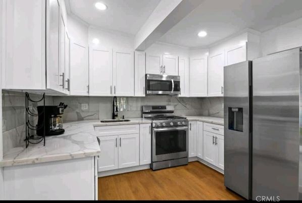 Interior, Kitchen, Recessed Lighting, Stainless Steel Appliances, Wood Texture Flooring