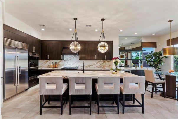 Interior, Kitchen, Marble Walls, Pendant Lights, Recessed Lighting, Stainless Steel Appliances