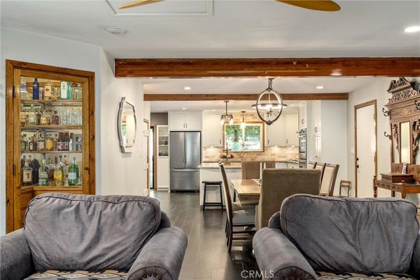 Dining room, Interior, Kitchen, Living room, Pendant Lights, Recessed Lighting, Stainless Steel Appliances, Wooden Beams, Wood Texture Flooring