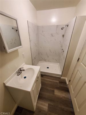 Bathroom, Dual Sink Vanities, Interior, Marble Walls, Wood Texture Flooring