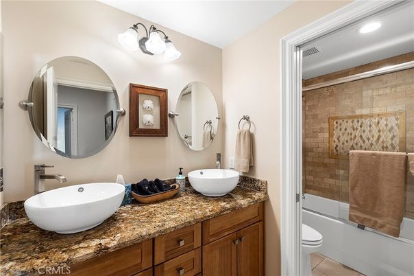 Bathroom, Dual Sink Vanities, Glass Shower, Interior, Recessed Lighting, Stone Walls
