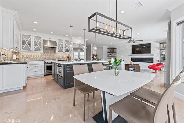 Dining room, Fireplace, Interior, Kitchen, Pendant Lights, Recessed Lighting, Stainless Steel Appliances, Stone Walls