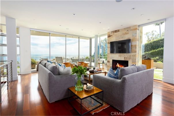 Fireplace, Interior, Living room, Recessed Lighting, Stone Walls, Water, Wood Texture Flooring