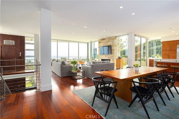 Dining room, Fireplace, Interior, Kitchen, Living room, Recessed Lighting, Stone Walls, Wood Texture Flooring