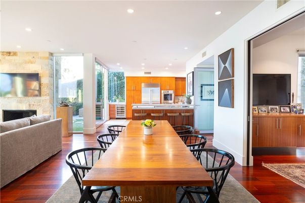 Dining room, Fireplace, Interior, Kitchen, Recessed Lighting, Stainless Steel Appliances, Wood Texture Flooring