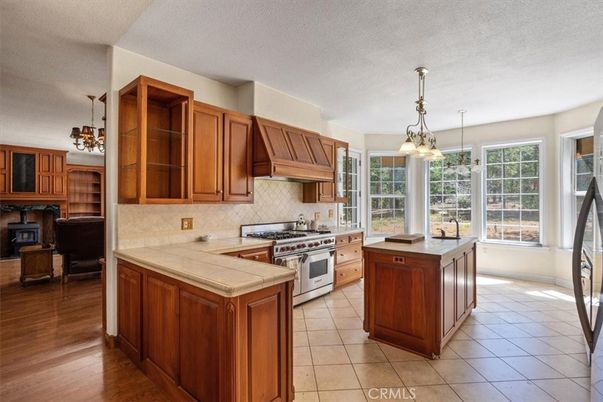 Fireplace, Interior, Kitchen, Pendant Lights, Tile Countertops, Wood Texture Flooring