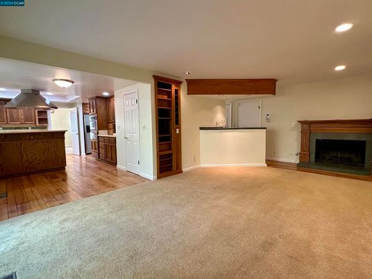 Empty room, Fireplace, Interior, Kitchen, Recessed Lighting, Wood Texture Flooring