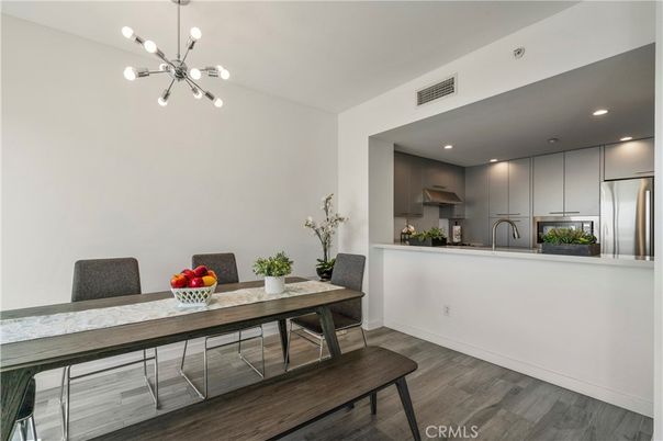 Dining room, Interior, Kitchen, Pendant Lights, Recessed Lighting, Stainless Steel Appliances, Wood Texture Flooring