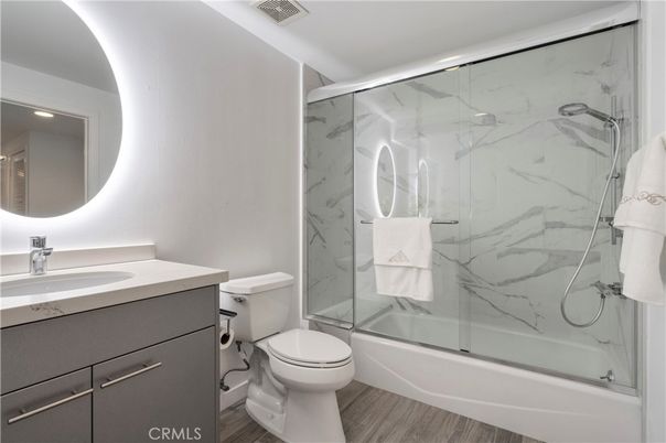 Bathroom, Glass Shower, Interior, Marble Walls, Recessed Lighting, Wood Texture Flooring