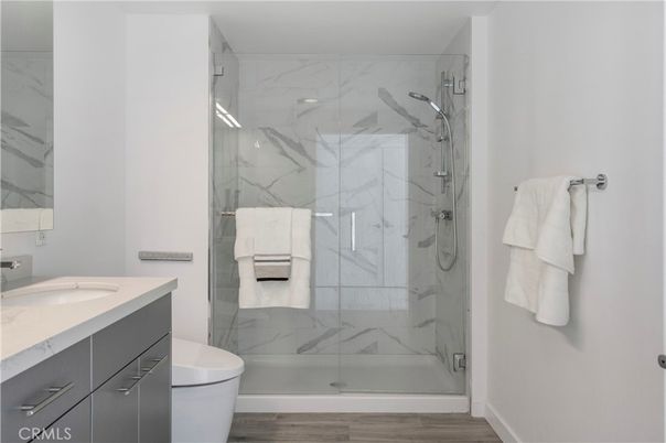 Bathroom, Glass Shower, Interior, Marble Walls, Wood Texture Flooring