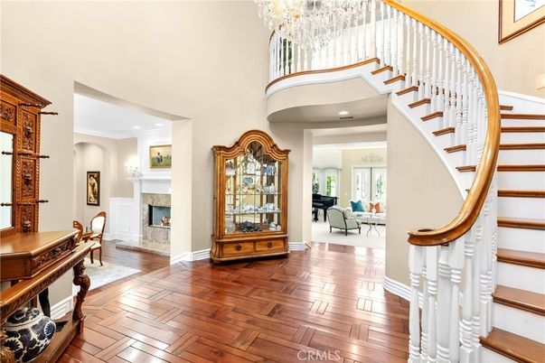 Chandelier, Fireplace, Interior, Piano, Recessed Lighting, Wood Texture Flooring