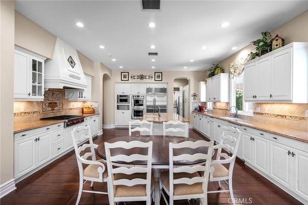 Dining room, Interior, Kitchen, Recessed Lighting, Stainless Steel Appliances, Wood Texture Flooring