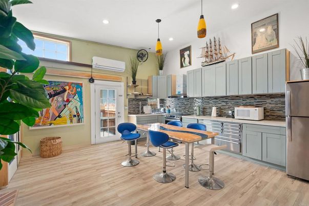 Dining room, Interior, Kitchen, Pendant Lights, Recessed Lighting, Stainless Steel Appliances, Wood Texture Flooring