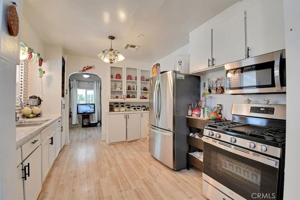 Chandelier, Interior, Kitchen, Pendant Lights, Stainless Steel Appliances, Wood Texture Flooring