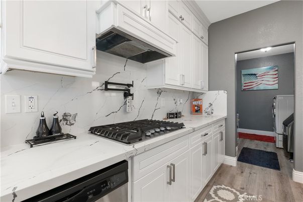 Interior, Kitchen, Marble Walls, Stainless Steel Appliances, Wood Texture Flooring