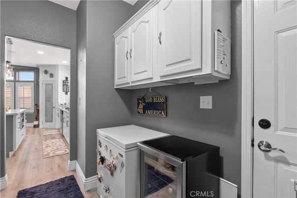 Interior, Kitchen, Recessed Lighting, Washer, Wood Texture Flooring