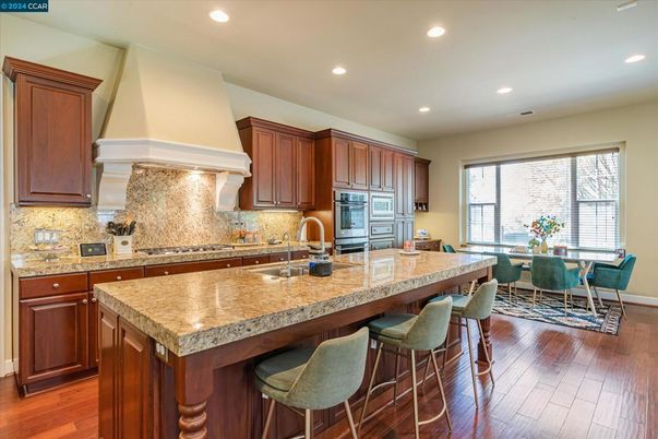 Dining room, Interior, Kitchen, Recessed Lighting, Stainless Steel Appliances, Wood Texture Flooring