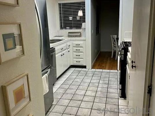 Interior, Kitchen, Pendant Lights, Tile Countertops, Wood Texture Flooring