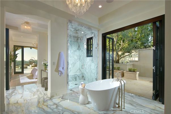 Bathroom, Chandelier, Free Standing Baths, Glass Shower, Interior, Marble, Marble Walls, Recessed Lighting
