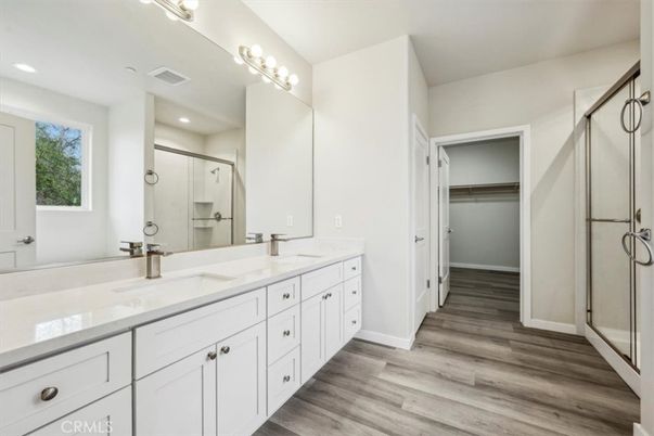 Bathroom, Dual Sink Vanities, Glass Shower, Interior, Recessed Lighting, Wood Texture Flooring