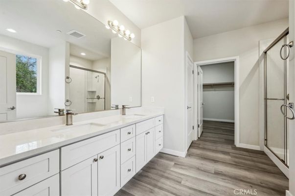 Bathroom, Dual Sink Vanities, Glass Shower, Interior, Recessed Lighting, Wood Texture Flooring