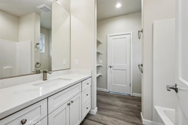 Bathroom, Dual Sink Vanities, Interior, Recessed Lighting, Wood Texture Flooring