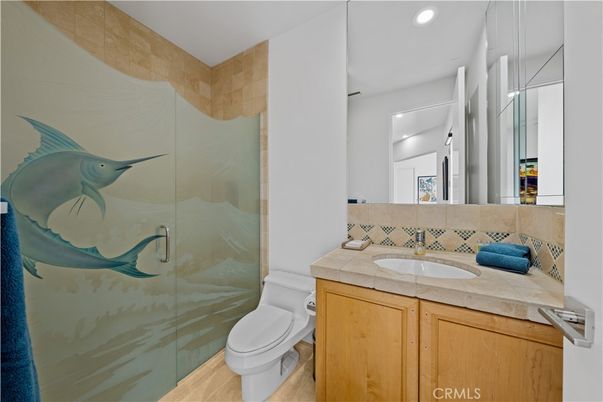 Bathroom, Glass Shower, Interior, Recessed Lighting, Tile Countertops, Wood Texture Flooring