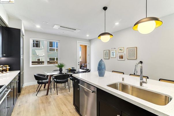 Dining room, Interior, Kitchen, Pendant Lights, Recessed Lighting, Stainless Steel Appliances, Wood Texture Flooring