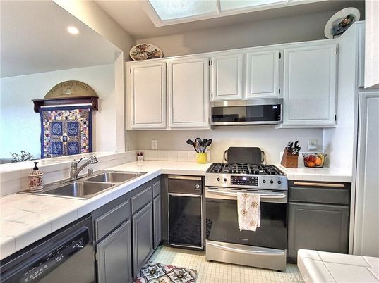 Interior, Kitchen, Recessed Lighting, Stainless Steel Appliances, Tile Countertops