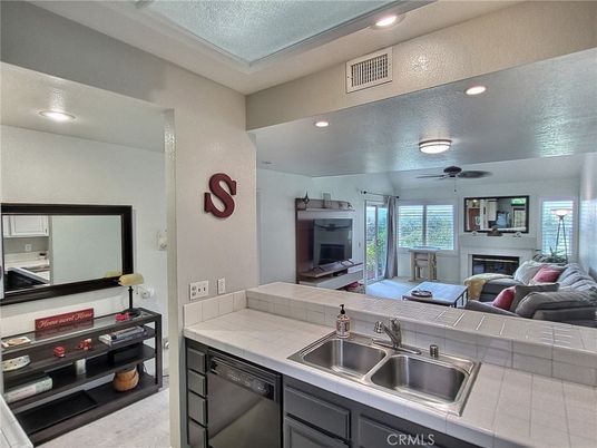Fireplace, Interior, Kitchen, Recessed Lighting, Tile Countertops