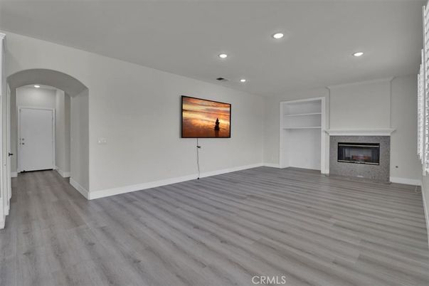 Empty room, Fireplace, Interior, Recessed Lighting, Wood Texture Flooring