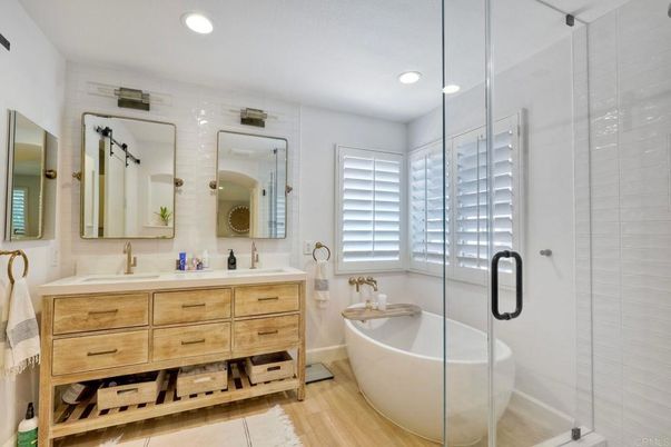 Bathroom, Dual Sink Vanities, Free Standing Baths, Glass Shower, Interior, Recessed Lighting, Wood Texture Flooring