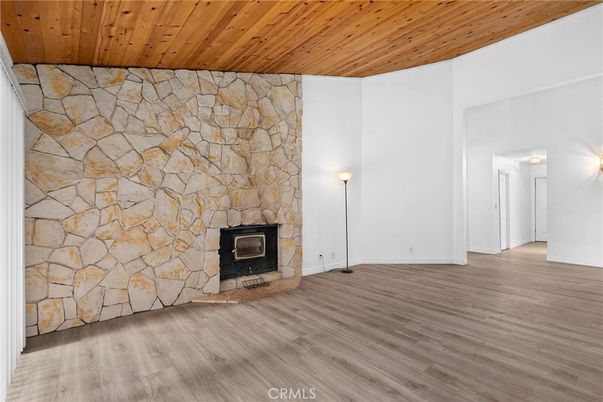 Empty room, Fireplace, Interior, Stone Walls, Wooden Ceilings, Wood Texture Flooring