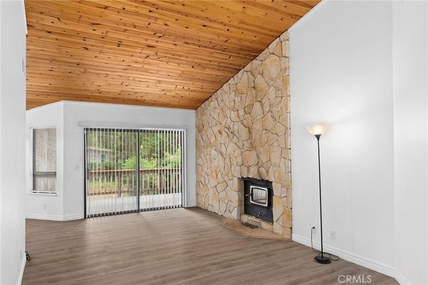 Empty room, Fireplace, Interior, Stone Walls, Wooden Ceilings, Wood Texture Flooring