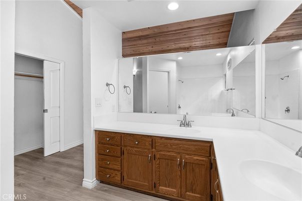 Bathroom, Dual Sink Vanities, Interior, Recessed Lighting, Wood Texture Flooring