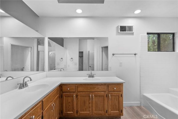 Bathroom, Dual Sink Vanities, Interior, Recessed Lighting, Wood Texture Flooring