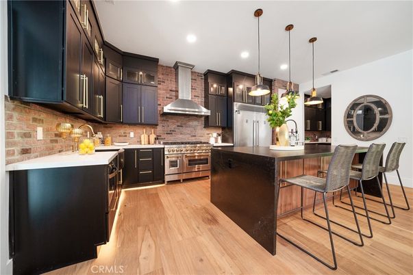 Interior, Kitchen, Pendant Lights, Recessed Lighting, Stainless Steel Appliances, Stone Walls, Wood Texture Flooring