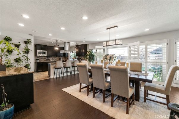 Dining room, Interior, Kitchen, Pendant Lights, Recessed Lighting, Stainless Steel Appliances, Wood Texture Flooring